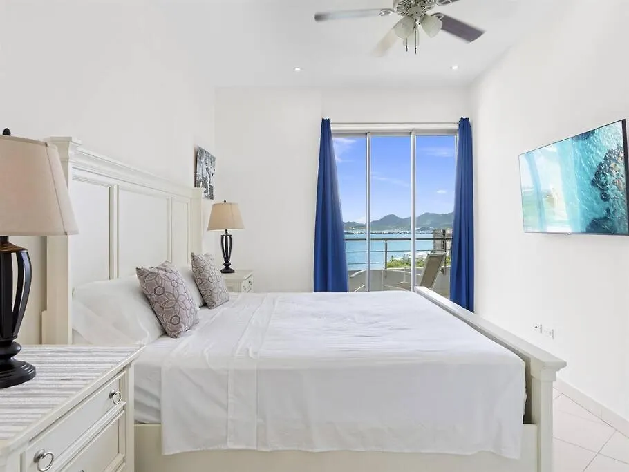 Апартаменты Luxury Lagoon-View Condo Steps To Beach Cupecoy