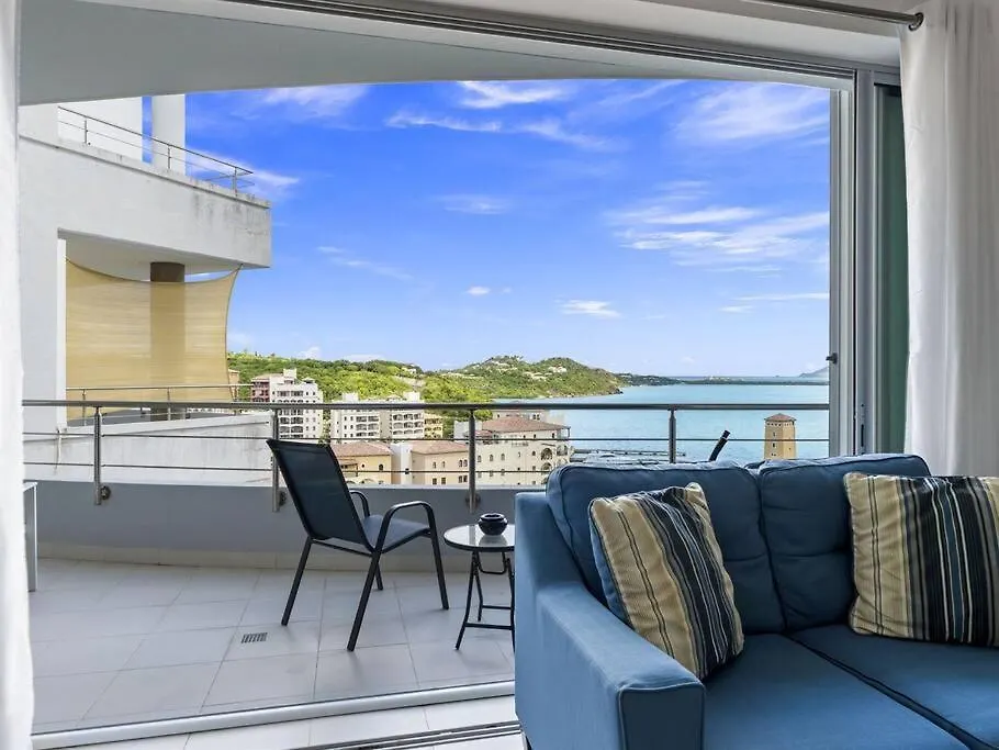 Апартаменты Luxury Lagoon-View Condo Steps To Beach Cupecoy